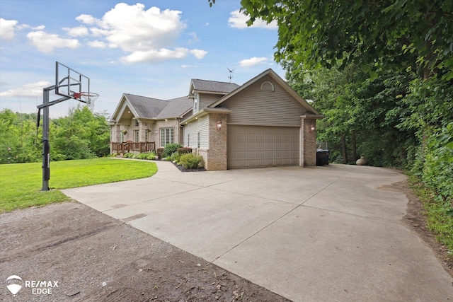 7266 Dodge Rd, Montrose, MI 48457 - view of front of house featuring brick siding, a front yard, an attached garage, and driveway