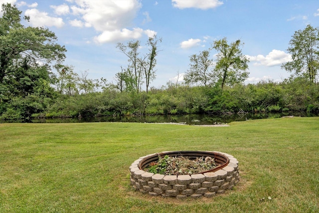 10224 Rexford Rd, Grass Lake, MI 49240 - view of green lawn with an outdoor fire pit