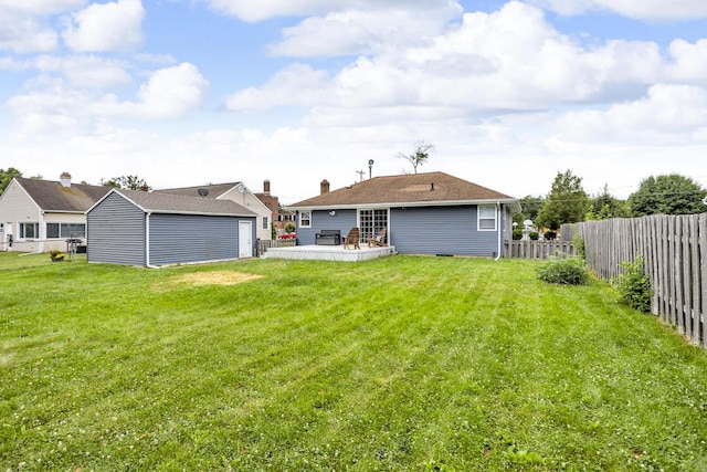 723 S Bowen St, Jackson, MI 49203 - rear view of property featuring an outdoor structure and a wooden deck