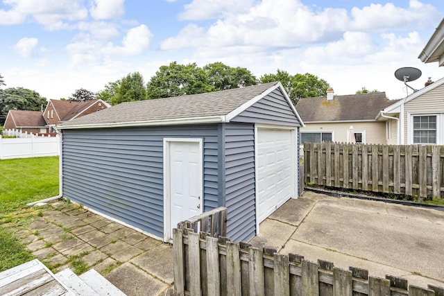 723 S Bowen St, Jackson, MI 49203 - view of outdoor structure featuring concrete driveway