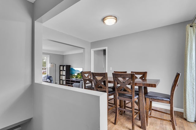723 S Bowen St, Jackson, MI 49203 - dining area with wood finished floors and baseboards