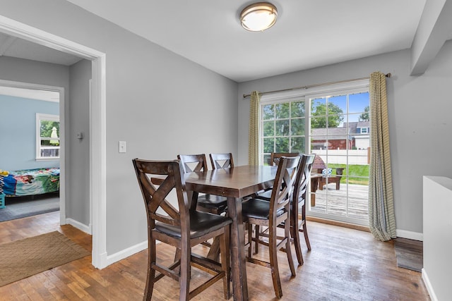 723 S Bowen St, Jackson, MI 49203 - dining area featuring hardwood / wood-style floors and baseboards
