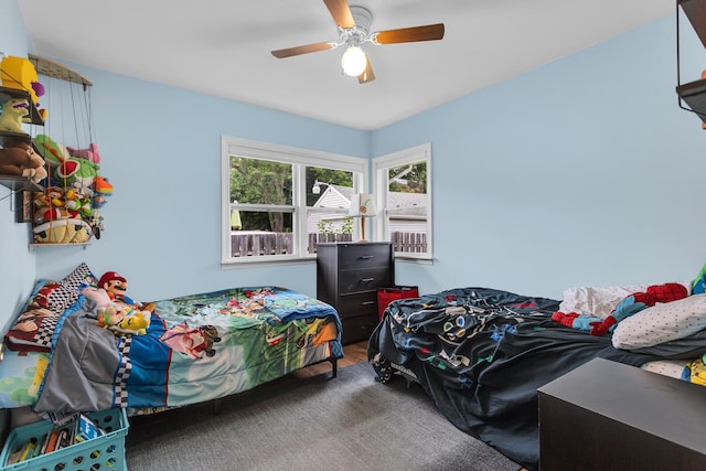 723 S Bowen St, Jackson, MI 49203 - bedroom with wood finished floors and ceiling fan