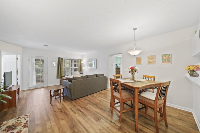 824 W Barrington Cir, Jackson, MI 49203 - dining space with light wood-type flooring