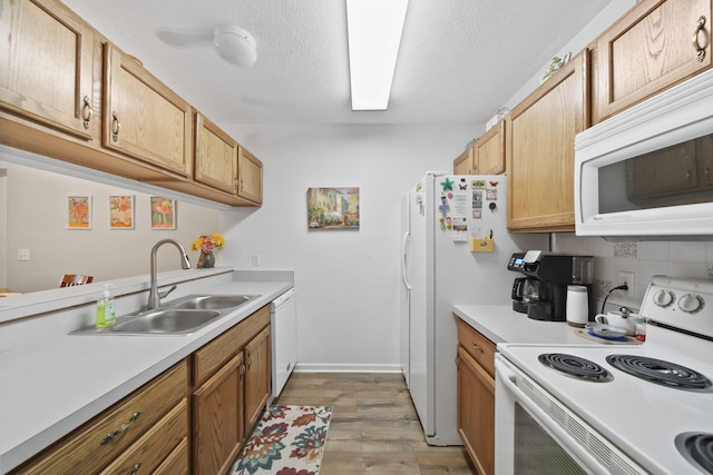824 W Barrington Cir, Jackson, MI 49203 - kitchen with white appliances, light countertops, light wood finished floors, backsplash, and a textured ceiling