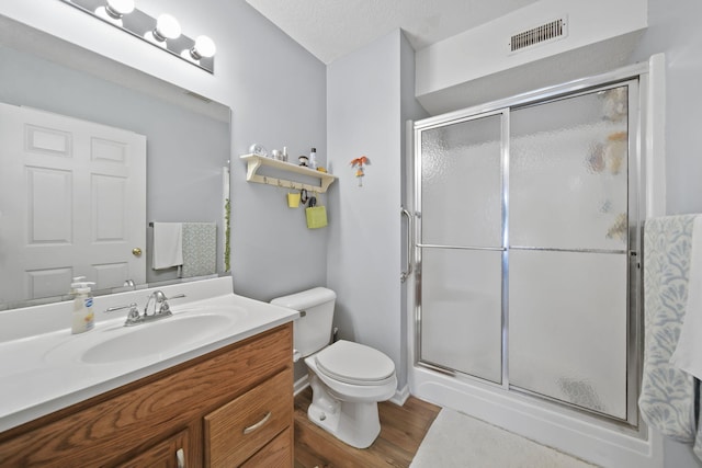 824 W Barrington Cir, Jackson, MI 49203 - bathroom with vanity, a stall shower, and wood finished floors