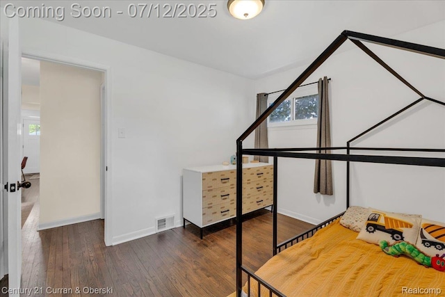 23139 Deziel St, Saint Clair Shores, MI 48082 - bedroom with multiple windows and wood finished floors