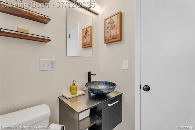 23139 Deziel St, Saint Clair Shores, MI 48082 - half bath featuring toilet and vanity