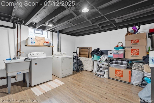 23139 Deziel St, Saint Clair Shores, MI 48082 - laundry area with separate washer and dryer and light wood-style floors