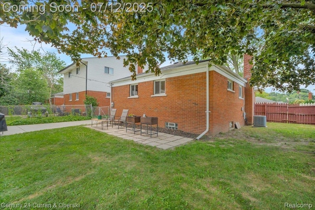 23139 Deziel St, Saint Clair Shores, MI 48082 - rear view of house featuring brick siding, a chimney, and a patio area
