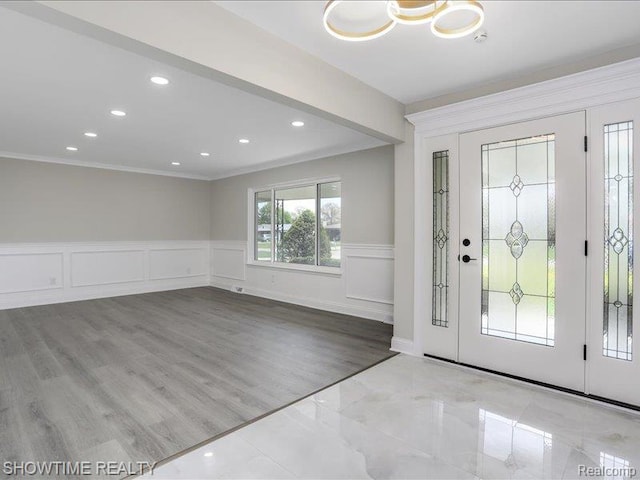 37305 Maas Dr, Sterling Heights, MI 48312 - foyer entrance featuring ornamental molding, a wainscoted wall, a decorative wall, recessed lighting, and wood finished floors