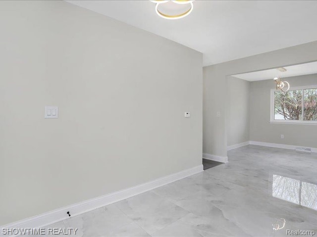 37305 Maas Dr, Sterling Heights, MI 48312 - spare room featuring a chandelier and light marble finish floors