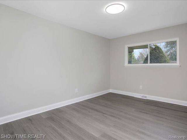 37305 Maas Dr, Sterling Heights, MI 48312 - empty room featuring wood finished floors and baseboards