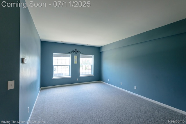 231 Main St, Belleville, MI 48111 - spare room featuring carpet floors and baseboards