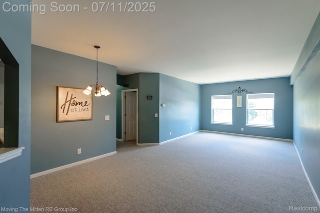 231 Main St, Belleville, MI 48111 - carpeted empty room featuring a chandelier and baseboards