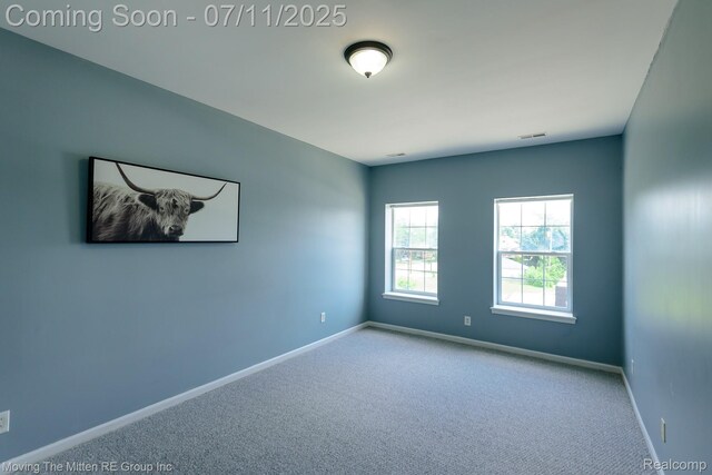 231 Main St, Belleville, MI 48111 - carpeted spare room featuring baseboards