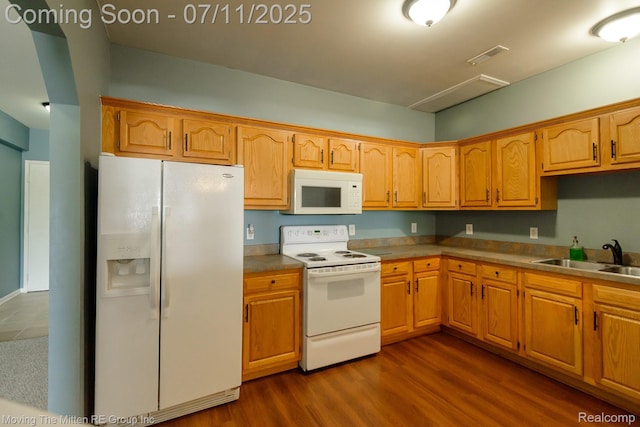 231 Main St, Belleville, MI 48111 - kitchen featuring white appliances and dark wood-type flooring