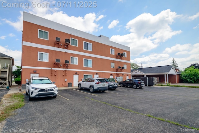 231 Main St, Belleville, MI 48111 - view of building exterior with uncovered parking