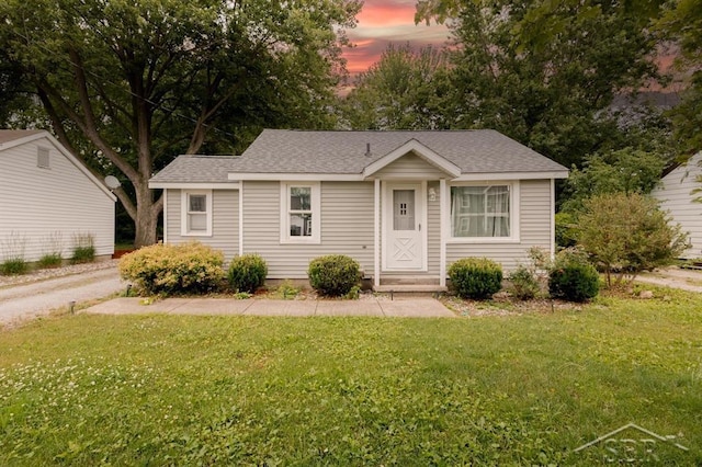 1312 Bayliss St, Midland, MI 48640 - view of front of property featuring a yard and roof with shingles