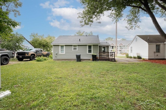 1312 Bayliss St, Midland, MI 48640 - rear view of house featuring a yard