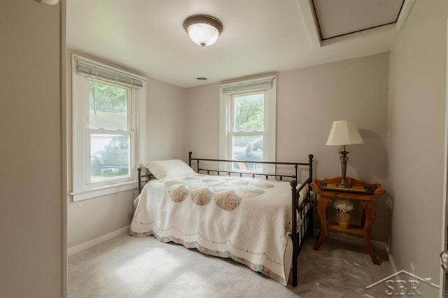 1312 Bayliss St, Midland, MI 48640 - bedroom featuring baseboards and attic access