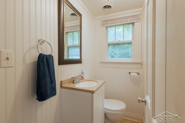 1312 Bayliss St, Midland, MI 48640 - bathroom featuring vanity and toilet