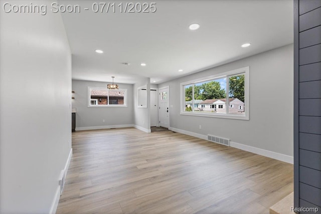22700 Garfield St, Saint Clair Shores, MI 48082 - unfurnished living room with healthy amount of natural light, wood finished floors, and recessed lighting
