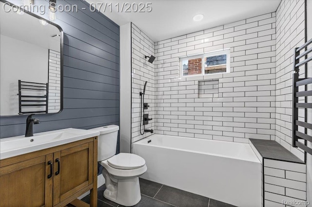 22700 Garfield St, Saint Clair Shores, MI 48082 - bathroom featuring a towel warming rack, tile patterned flooring, vanity, and washtub / shower combination