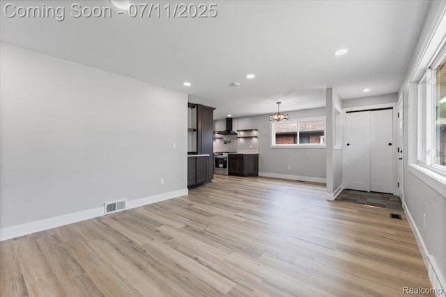 22700 Garfield St, Saint Clair Shores, MI 48082 - unfurnished living room featuring light wood-style flooring, a chandelier, and recessed lighting