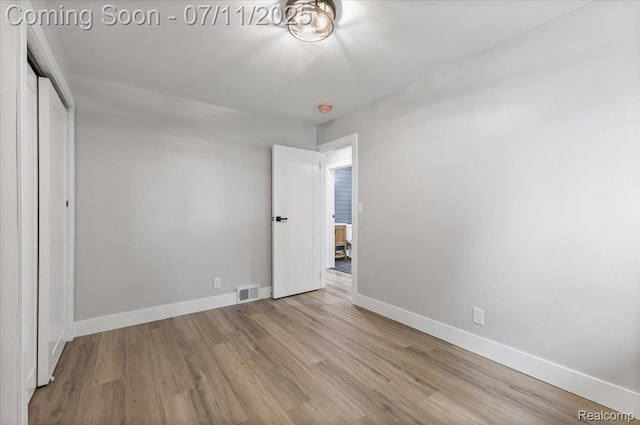 22700 Garfield St, Saint Clair Shores, MI 48082 - unfurnished bedroom with wood finished floors and a closet