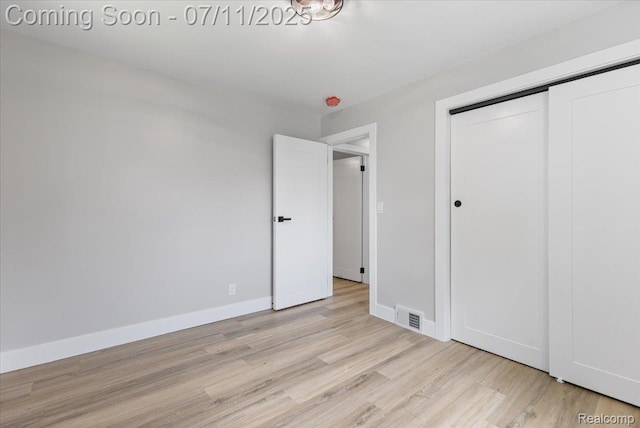 22700 Garfield St, Saint Clair Shores, MI 48082 - unfurnished bedroom featuring light wood-type flooring and a closet
