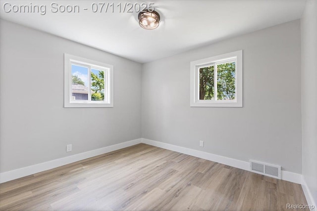 22700 Garfield St, Saint Clair Shores, MI 48082 - spare room with healthy amount of natural light and wood finished floors