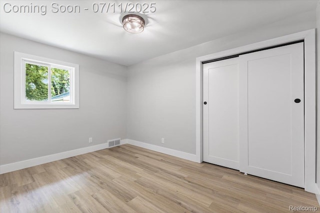 22700 Garfield St, Saint Clair Shores, MI 48082 - unfurnished bedroom featuring light wood-style floors and a closet