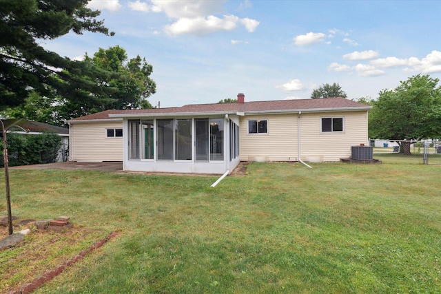 5452 Lucerne Ave, Kalamazoo, MI 49048 - rear view of property featuring a sunroom and a chimney