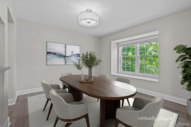 4350 Pine Ridge Ct, Ann Arbor, MI 48105 - dining area with baseboards and dark wood-type flooring