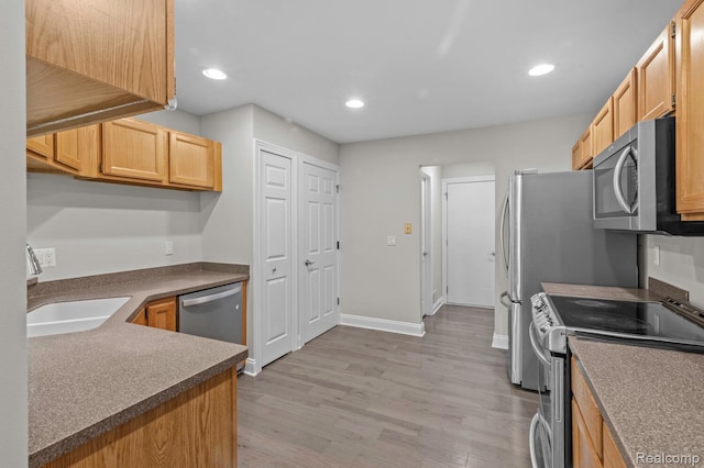 4350 Pine Ridge Ct, Ann Arbor, MI 48105 - kitchen featuring stainless steel appliances, light wood-style flooring, recessed lighting, and light brown cabinetry