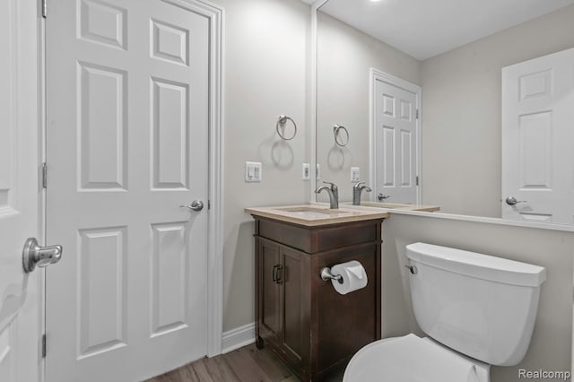4350 Pine Ridge Ct, Ann Arbor, MI 48105 - half bath featuring vanity and wood finished floors