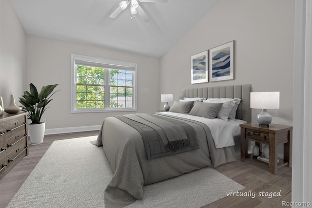 4350 Pine Ridge Ct, Ann Arbor, MI 48105 - bedroom featuring wood finished floors, lofted ceiling, and ceiling fan