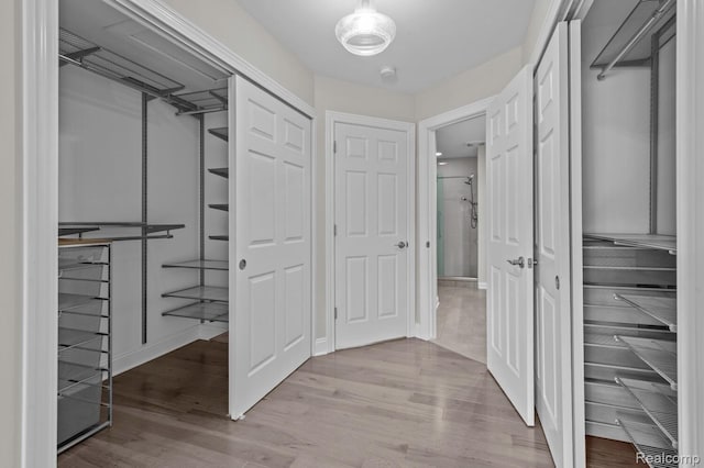 4350 Pine Ridge Ct, Ann Arbor, MI 48105 - spacious closet with wood finished floors