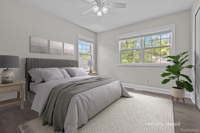 4350 Pine Ridge Ct, Ann Arbor, MI 48105 - bedroom with wood finished floors and a ceiling fan