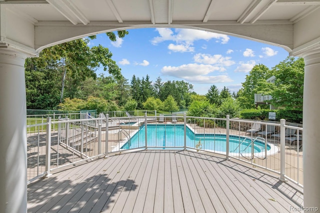 4350 Pine Ridge Ct, Ann Arbor, MI 48105 - community pool featuring a hot tub and view of wooded area