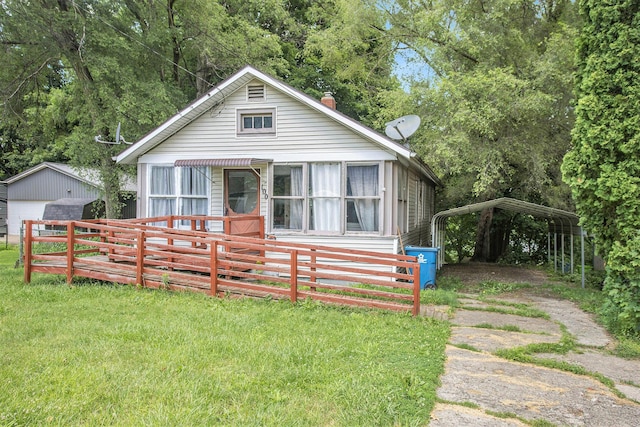 100 Eldred St, Battle Creek, MI 49015 - view of front facade featuring a detached carport and an outbuilding