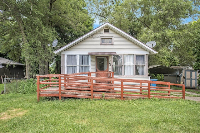100 Eldred St, Battle Creek, MI 49015 - view of front of home with a storage unit and a detached carport