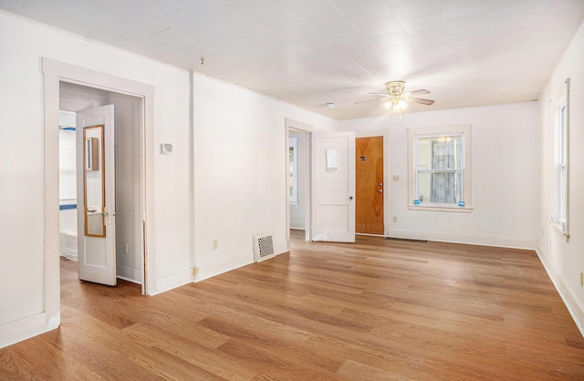 100 Eldred St, Battle Creek, MI 49015 - empty room with a ceiling fan and light wood-style floors