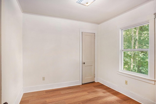 100 Eldred St, Battle Creek, MI 49015 - unfurnished room with light wood-style floors and ornamental molding