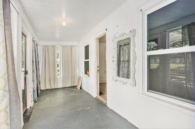 100 Eldred St, Battle Creek, MI 49015 - unfurnished sunroom with concrete floors