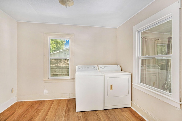 100 Eldred St, Battle Creek, MI 49015 - laundry room with independent washer and dryer and light wood-style floors