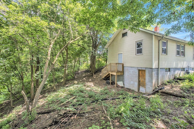 100 Eldred St, Battle Creek, MI 49015 - view of property exterior featuring a chimney