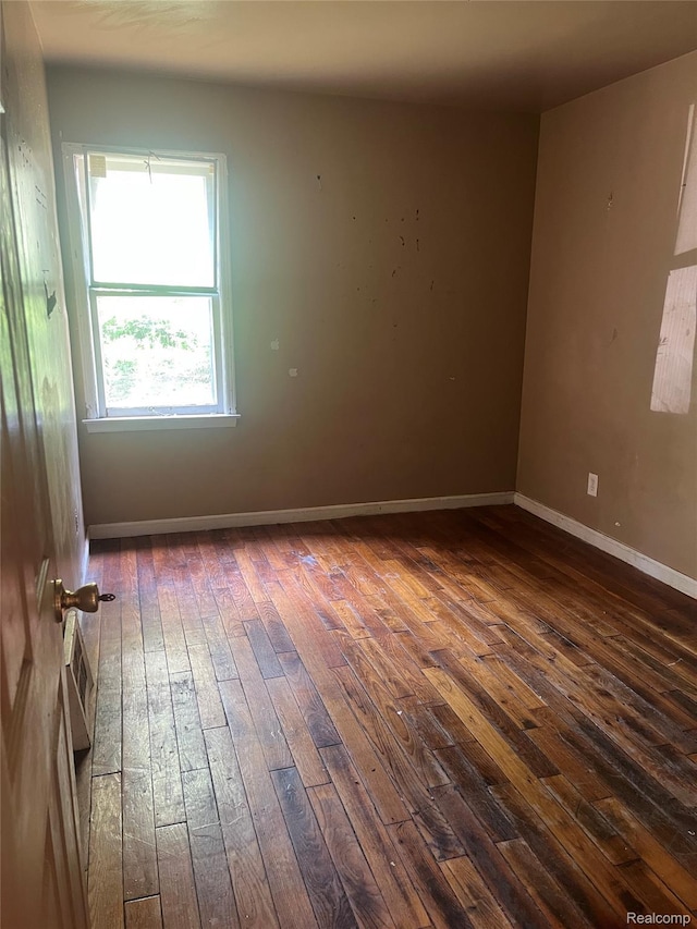 15682 Liberal St, Detroit, MI 48205 - unfurnished room featuring dark wood finished floors and baseboards