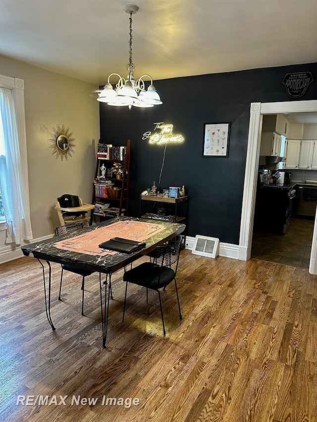 419 N Birney St, Bay City, MI 48708 - dining space with dark wood finished floors and a chandelier
